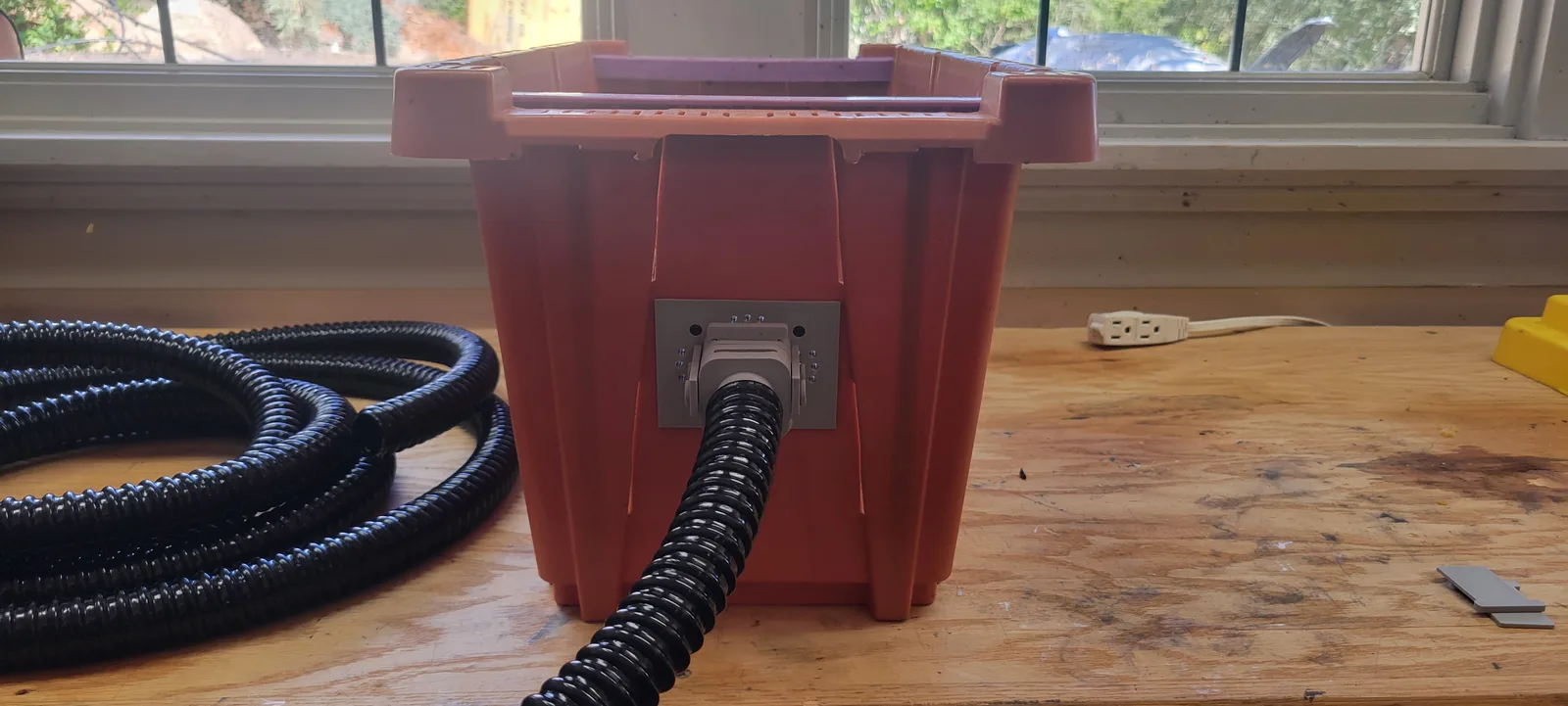 The nuc box with the corrugated hose connected to the tunnel adapter and running away out of frame.
