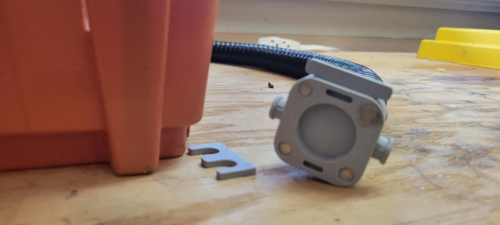 The quick connect with the hose attached and a printed door slid into the slot beside it.