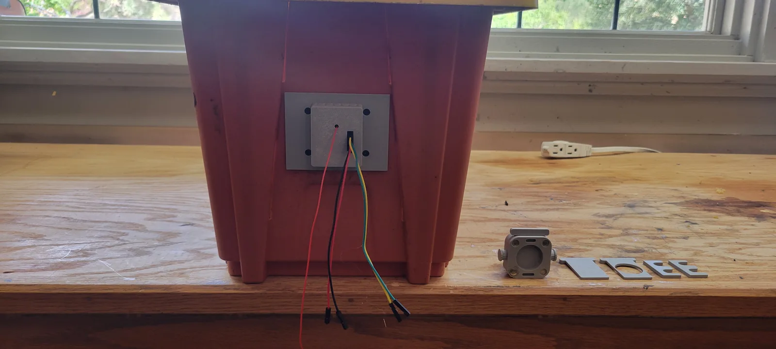 The same rear plate with the printed sensor cover fitted over the pocket.